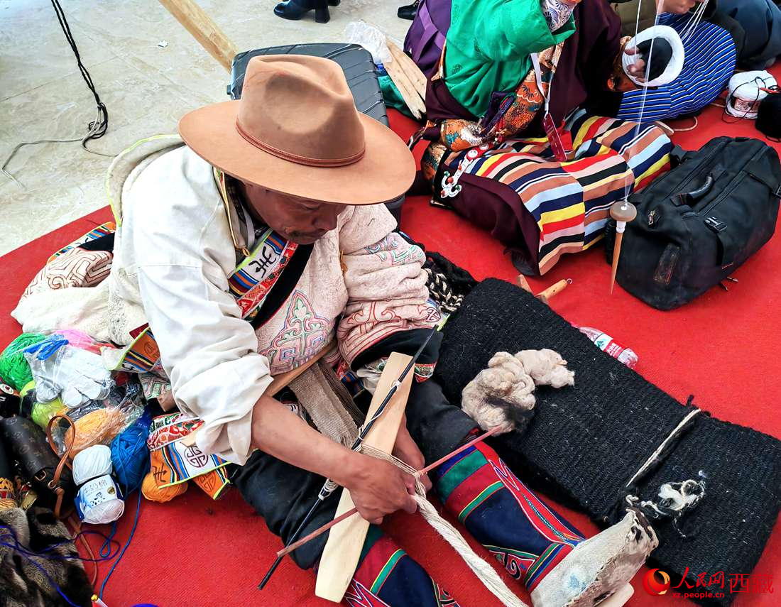 編織技能展示。人民網(wǎng) 李海霞攝